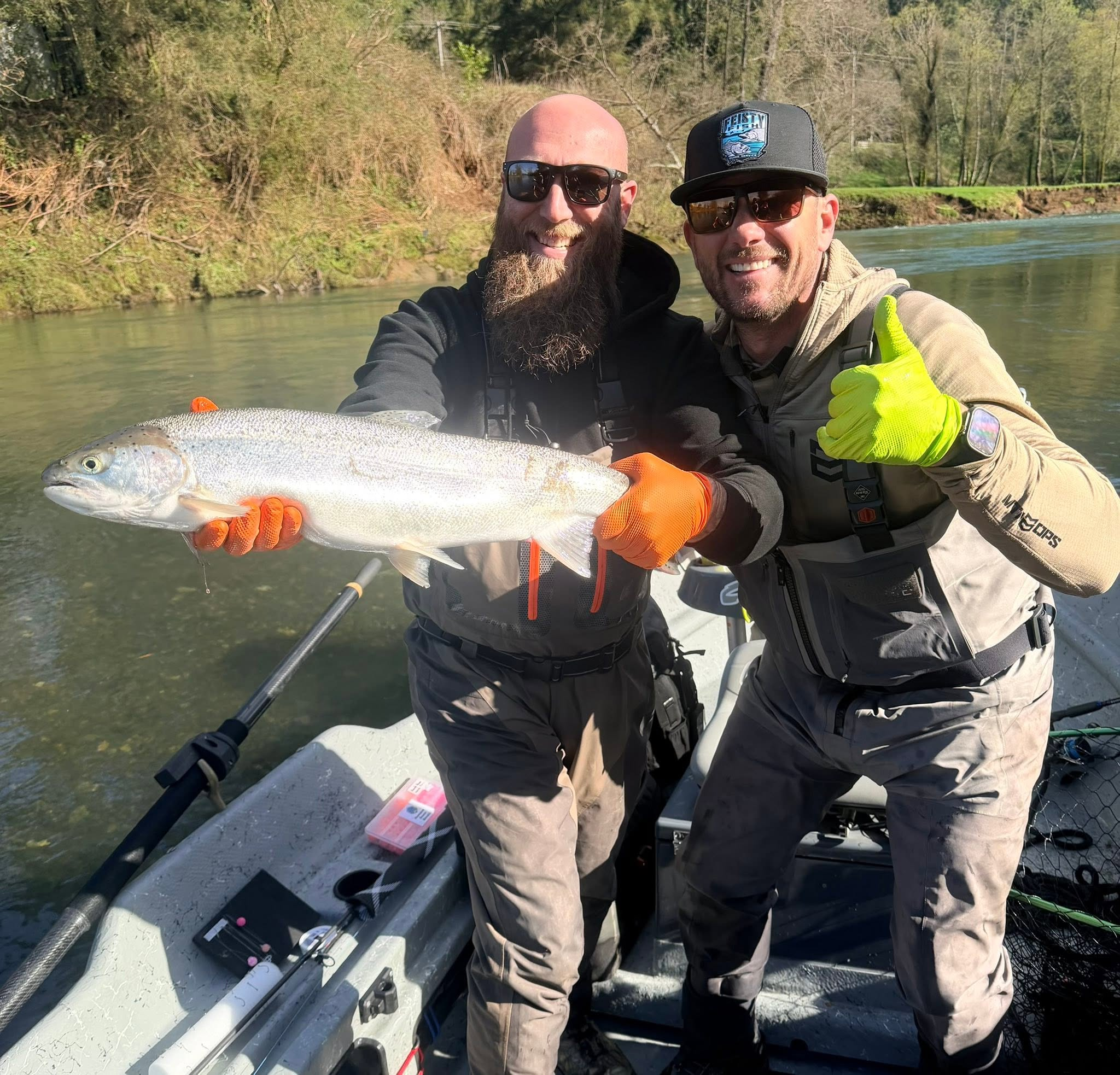 A winter steelhead angler and Scott Feist holding a fresh catch